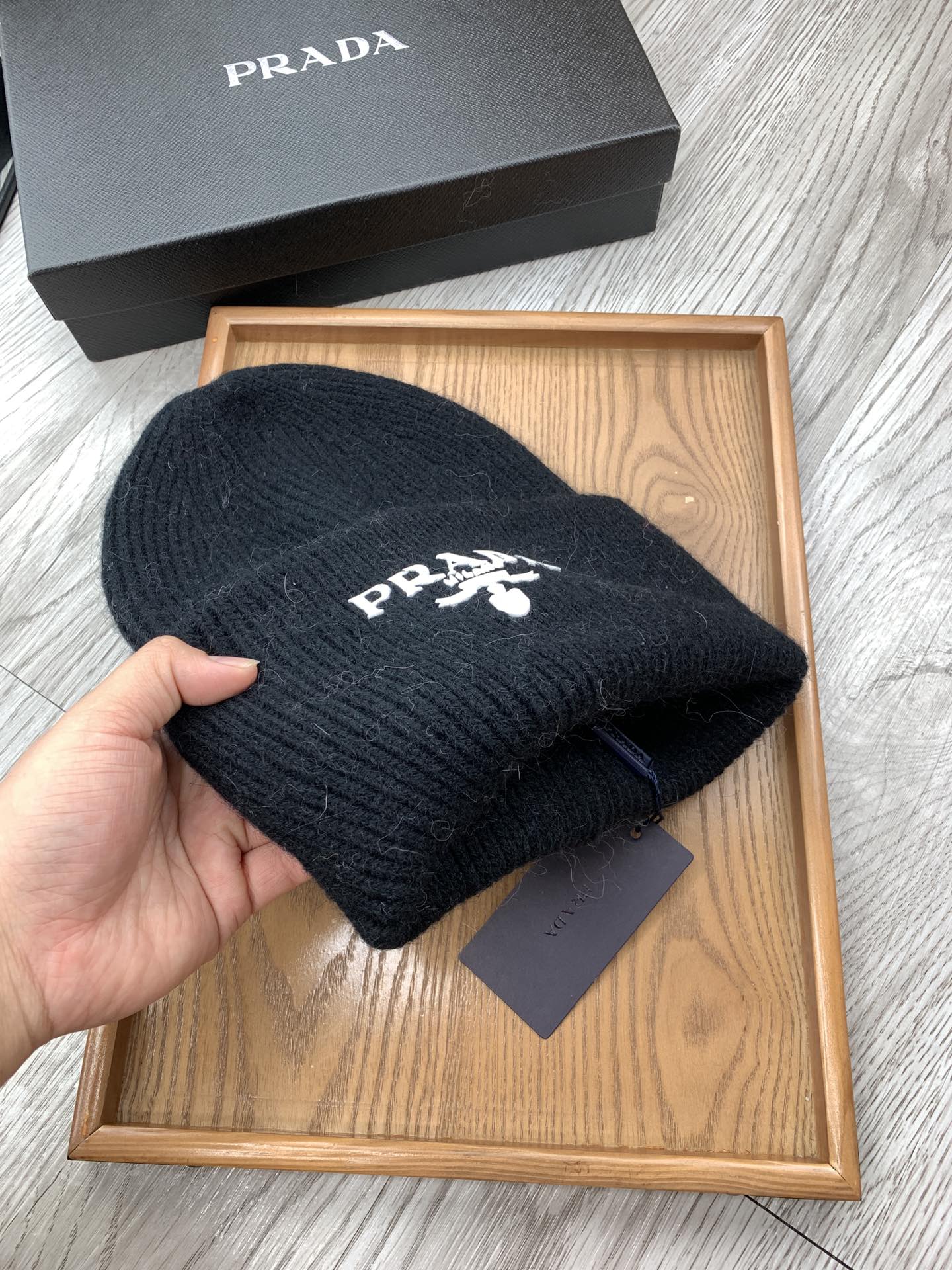 PRADA BEANIE HAT IN BLACK WOOL 108753