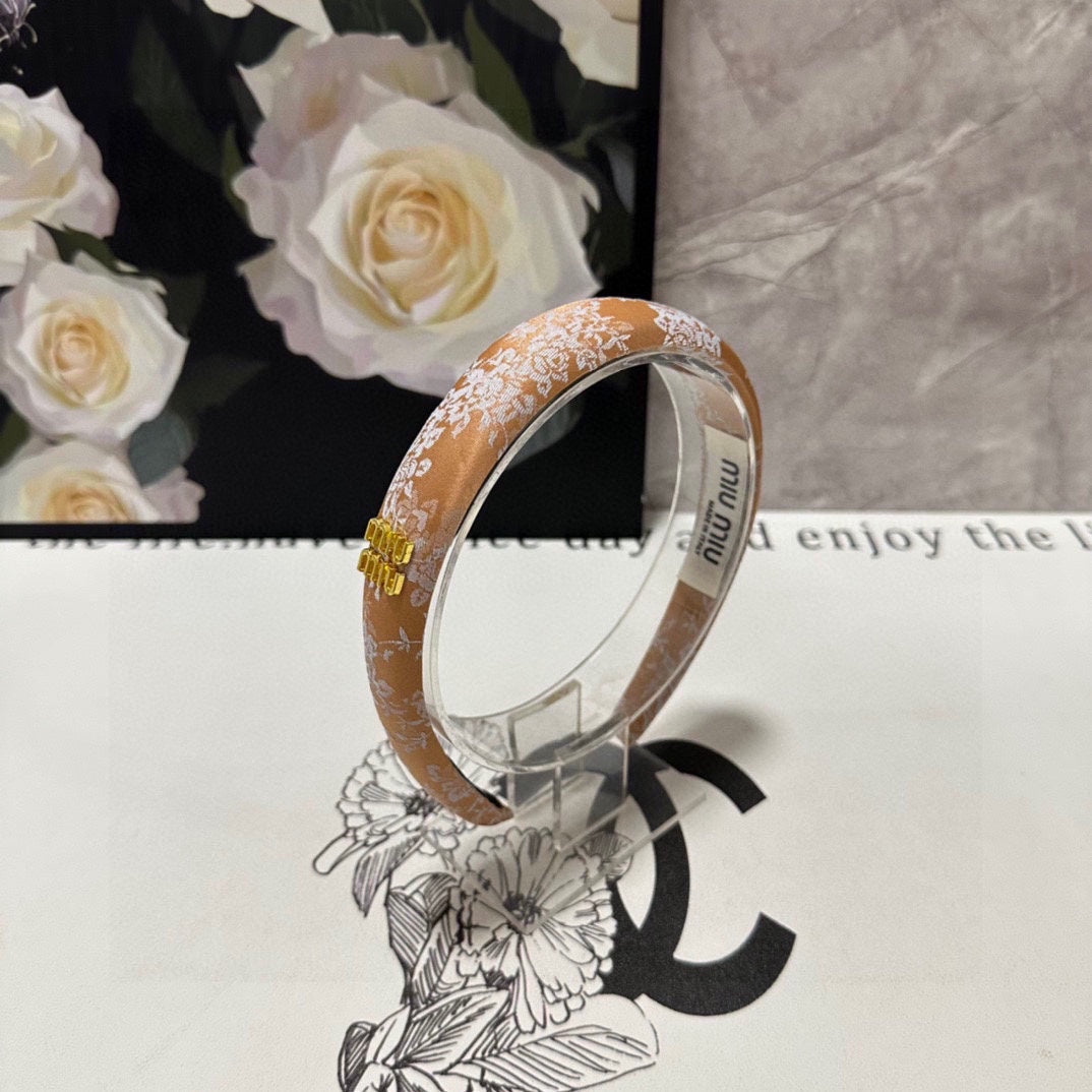 CHANEL HEADBAND WITH GARNITURE PRINT IN TIGER EYE ORANGE SILK 432822