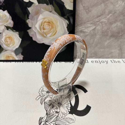 CHANEL HEADBAND WITH GARNITURE PRINT IN TIGER EYE ORANGE SILK 432822